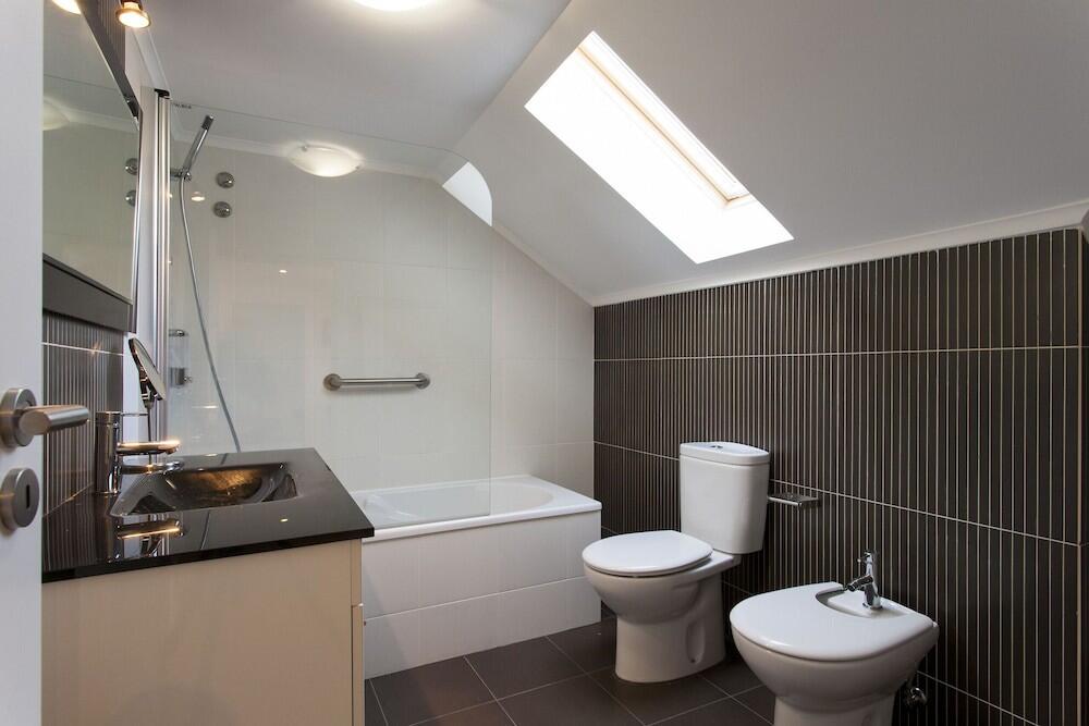 Foto del baño de Hotel SANTA JUSTA SUITE BY HOMING