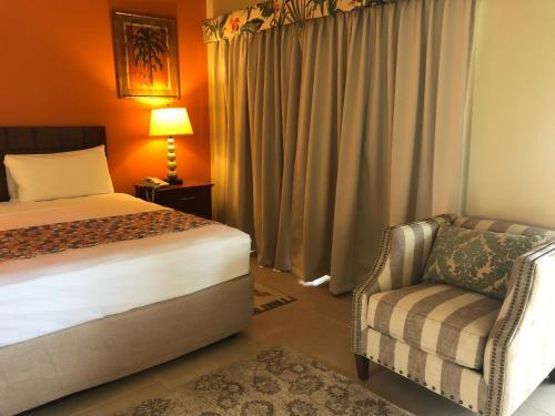 Foto de una habitación de Carl&amp;#039;s Unique Inn &amp;amp; Conference Facilities