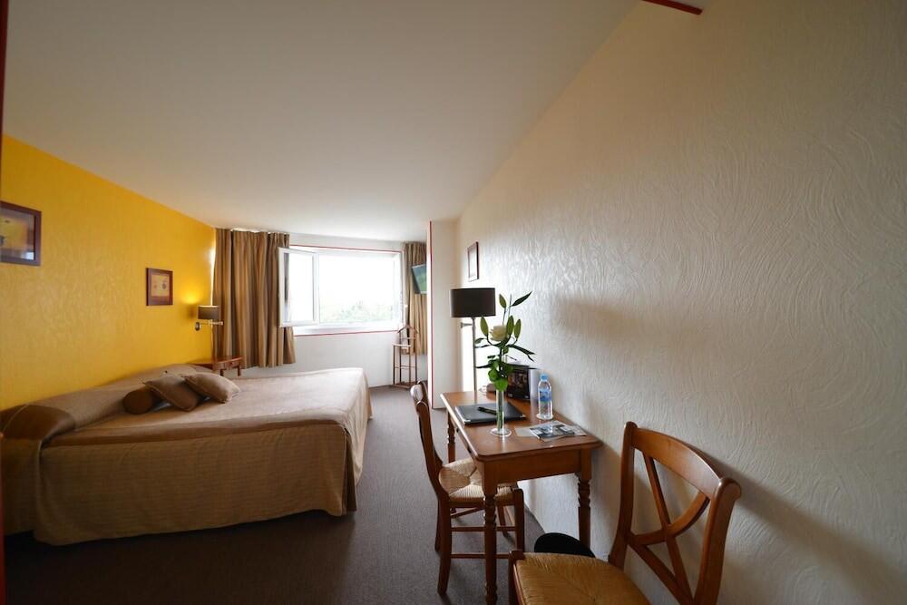 Foto de una habitación de Hotel Bomotel