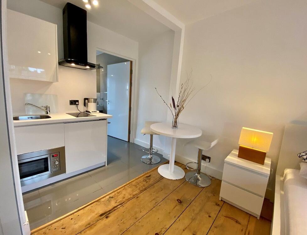 Foto de una habitación de Sun Street ApartHotel
