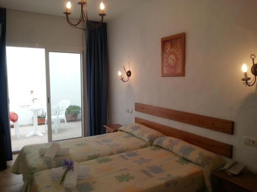 Foto de una habitación de Hotel Oasis Atalaya