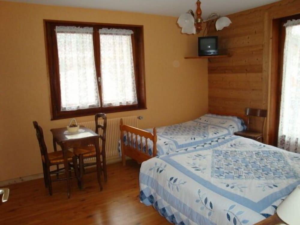 Foto de una habitación de Hotel Les Touristes