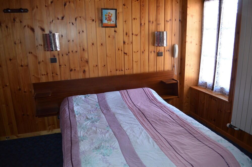 Foto de una habitación de Hotel Les Touristes