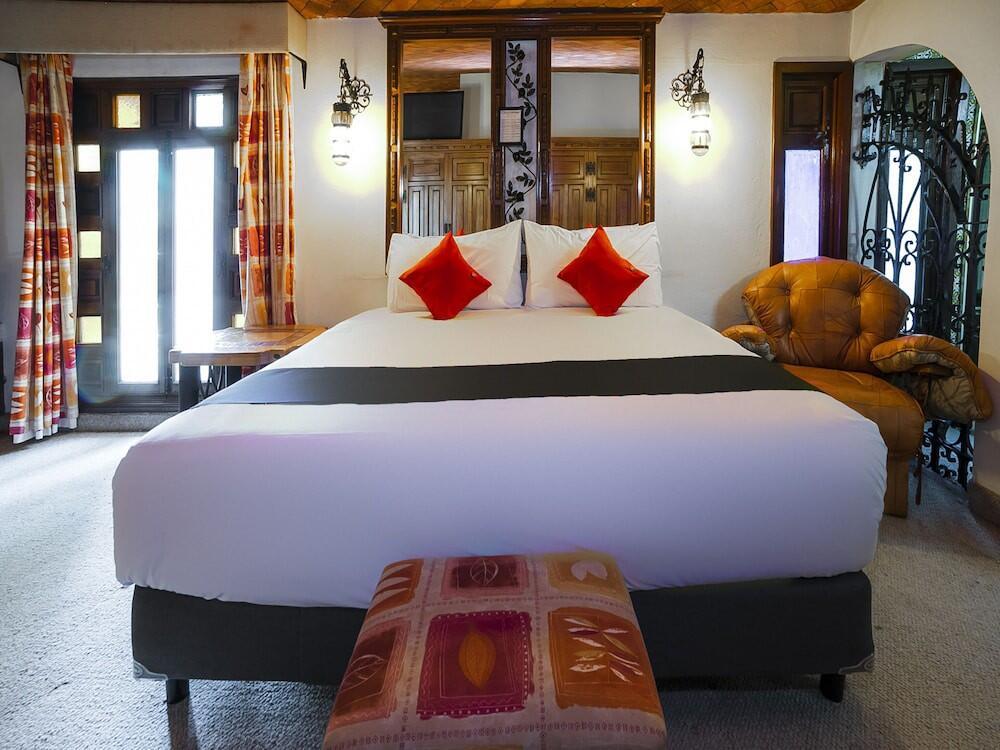 Foto de una habitación de Hotel La Mansion del Quijote