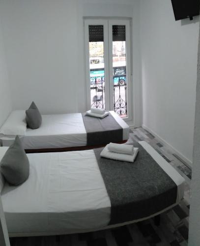 Foto de una habitación de Hostal H Noche y Dia