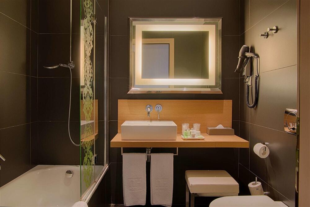 Foto del baño de Hotel NH Firenze