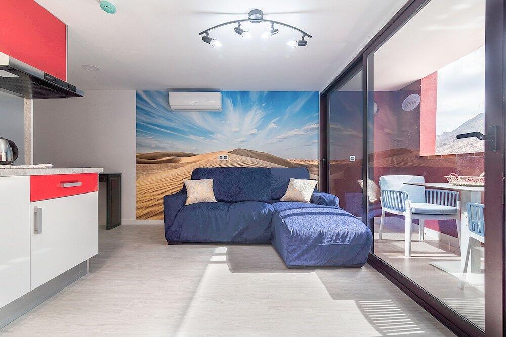 Foto de una habitación de Apartamentos Sol Mogan Suites