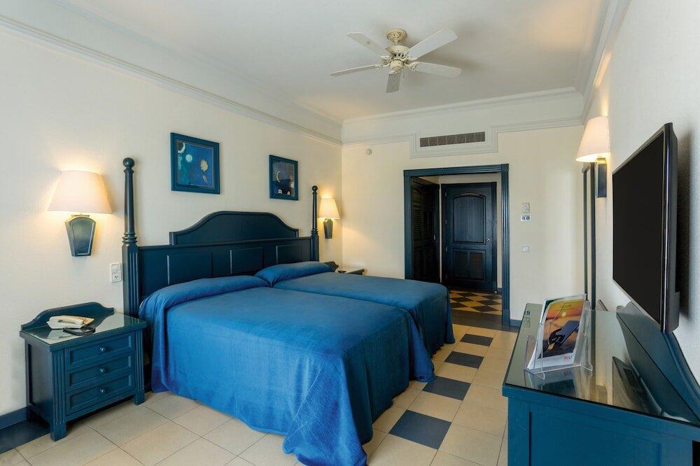 Foto de una habitación de Hotel Riu Emerald Bay All Inclusive