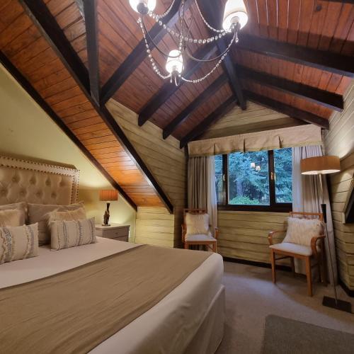 Foto de una habitación de Hotel Altos Los Pioneros &amp;amp; Spa