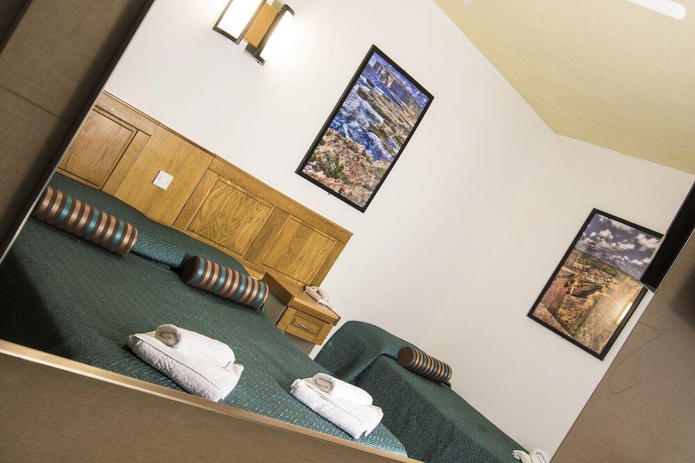 Foto de una habitación de Canifor Hotel