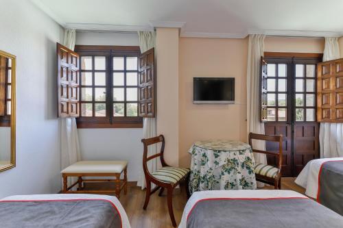Foto de una habitación de Hotel Santillana