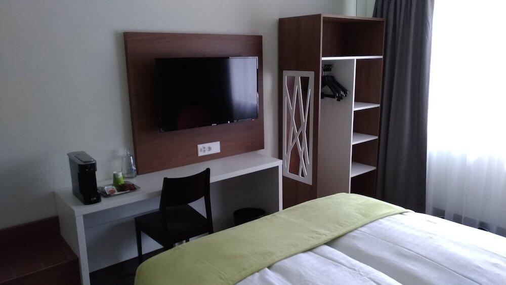 Foto de una habitación de Hotel Campanile Martigny
