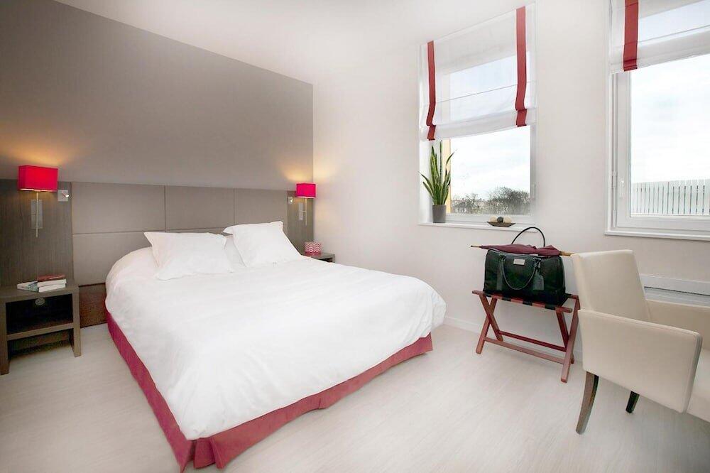 Foto de una habitación de Aparthotel Residhome Reims Centre