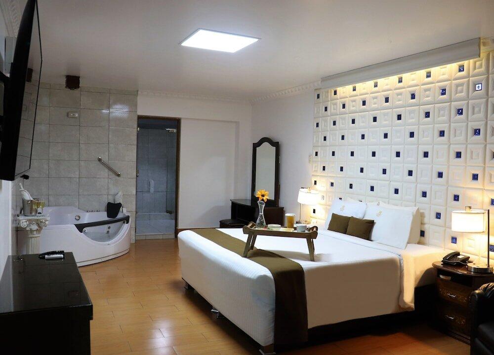 Foto de una habitación de Inkari Suites Hotel