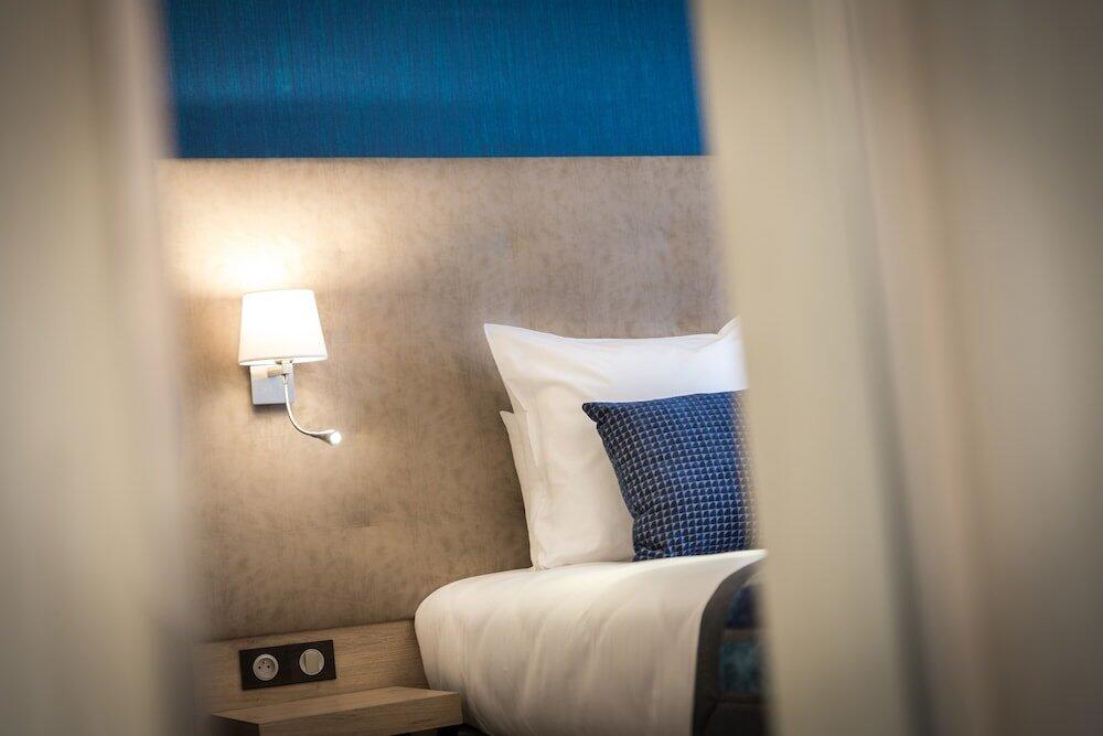 Foto de una habitación de Hôtel Le Rive Droite &amp;amp; SPA
