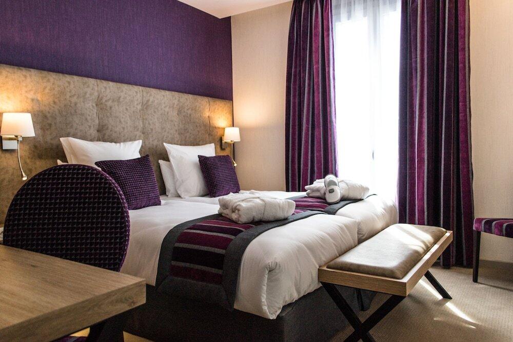 Foto de una habitación de Hôtel Le Rive Droite &amp;amp; SPA