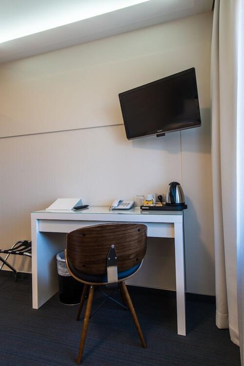 Foto de una habitación de Amrita Hotel