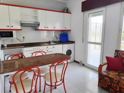 Foto de una habitación de Apartamentos Playa de la Lanzada 3000