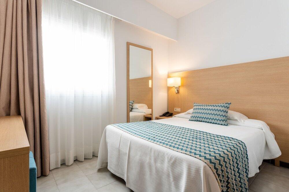Foto de una habitación de Hotel Riutort