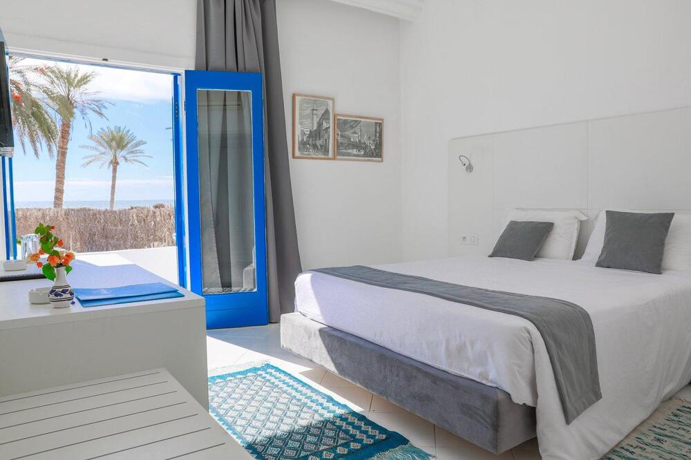 Foto de una habitación de Hotel COOEE Hari Club Beach Resort