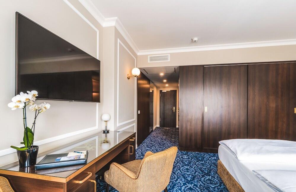 Foto de una habitación de Hotel Suitess