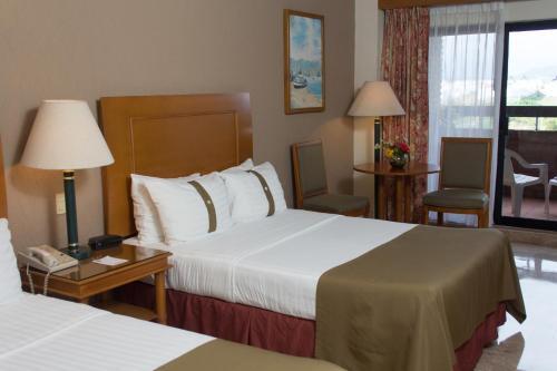 Foto de una habitación de Complejo The Palms Resort of Mazatlan