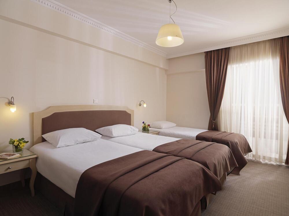 Foto de una habitación de Hotel Airotel Parthenon