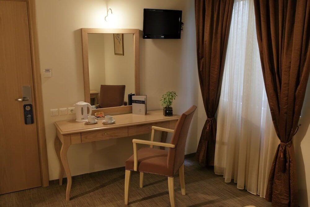Foto de una habitación de Hotel Airotel Parthenon