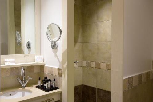 Foto del baño de Hotel Le Pinarello
