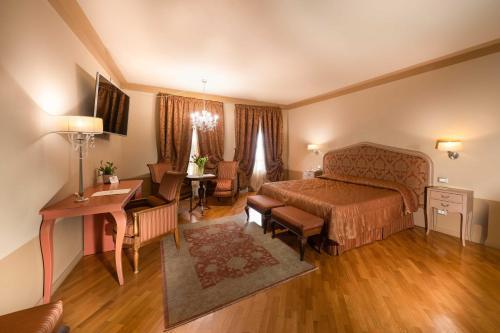 Foto de una habitación de Hotel San Luca Palace