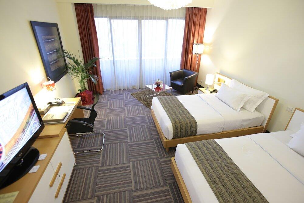 Foto de una habitación de Merlynn Park Hotel