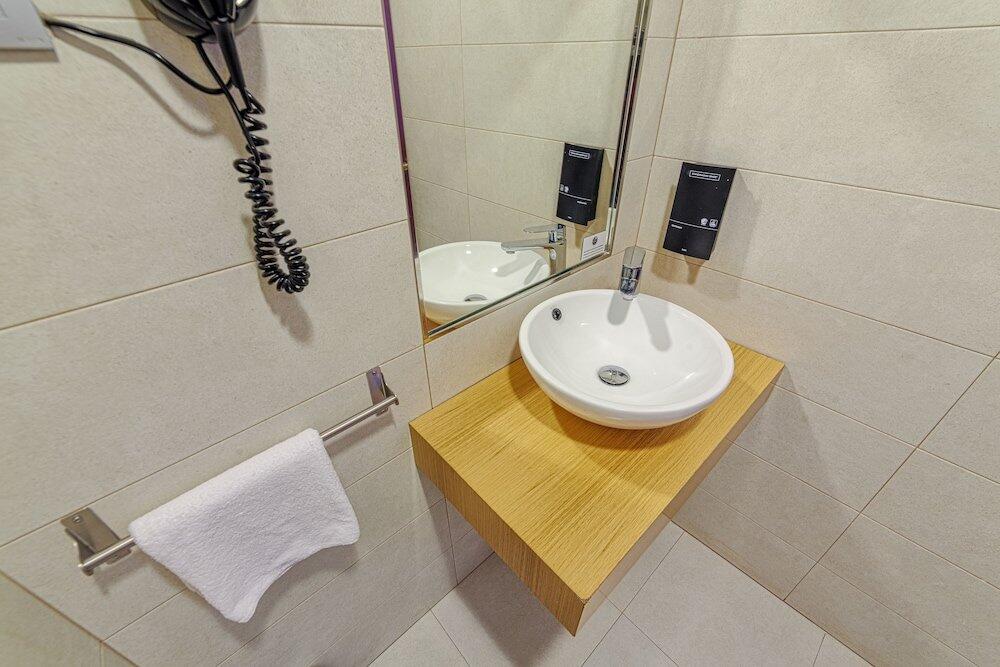 Foto del baño de Hotel La Perla