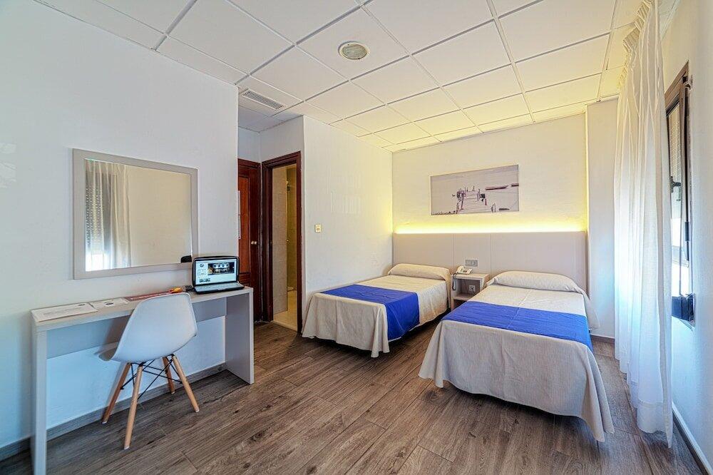 Foto de una habitación de Hotel La Perla