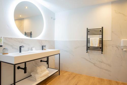 Foto del baño de Hotel La Cepada