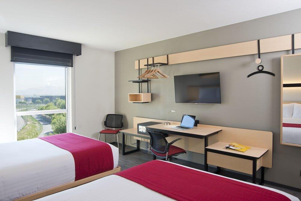 Foto de una habitación de Hotel City Express Santiago Aeropuerto