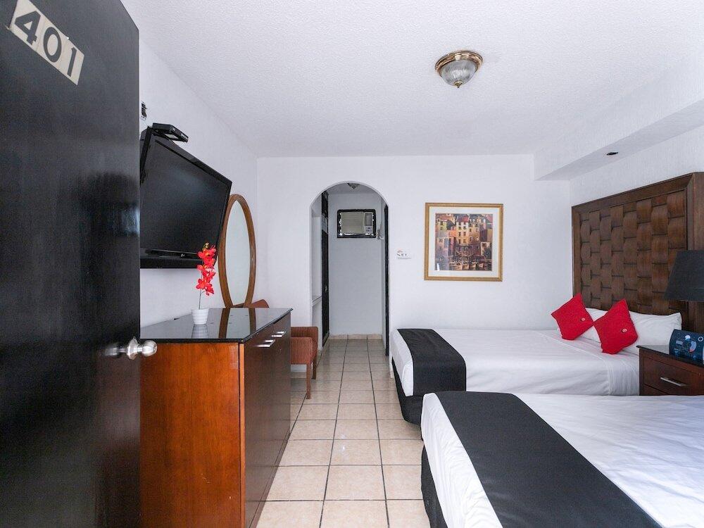 Foto de una habitación de Hotel Capital O Zona Dorada Inn, Mazatlán