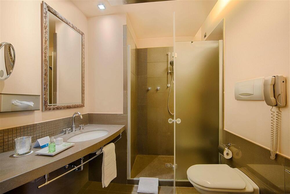 Foto del baño de Hotel NH Bergamo