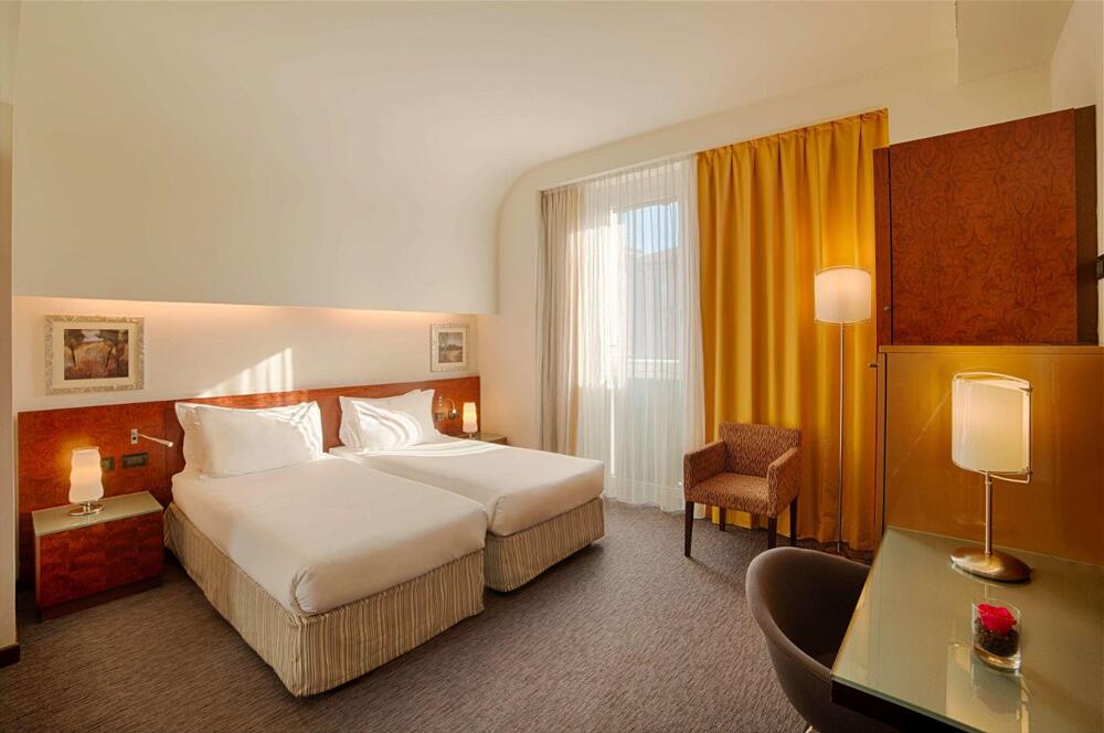Foto de una habitación de Hotel NH Bergamo