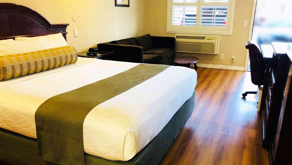 Foto de una habitación de Dynasty Suites Hotel