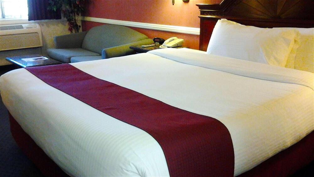 Foto de una habitación de Dynasty Suites Hotel