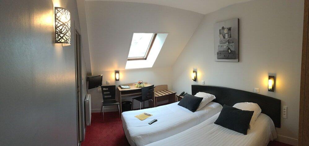 Foto de una habitación de Hotel Le Bayeux