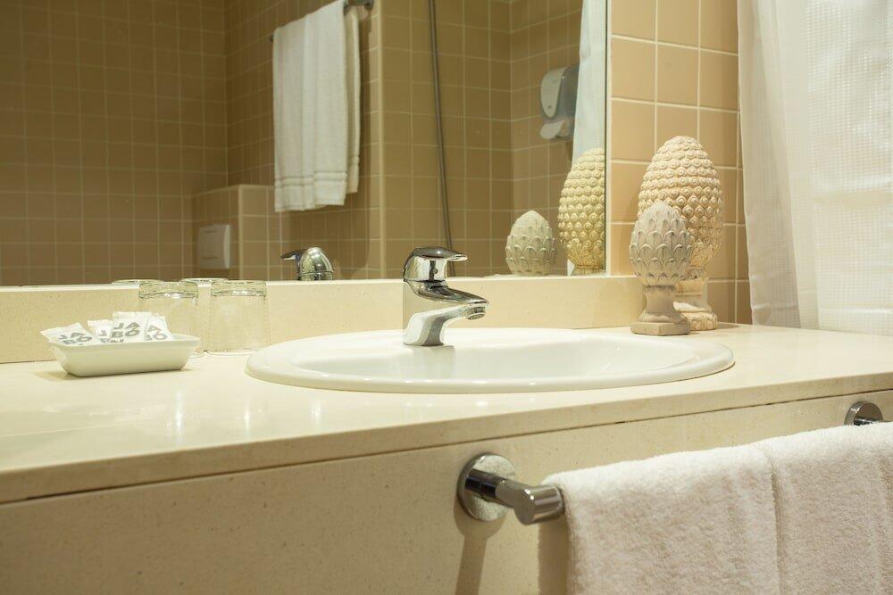 Foto del baño de Hotel Checkin Alaquas