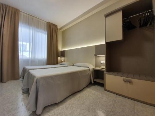 Foto de una habitación de Hotel Corallo