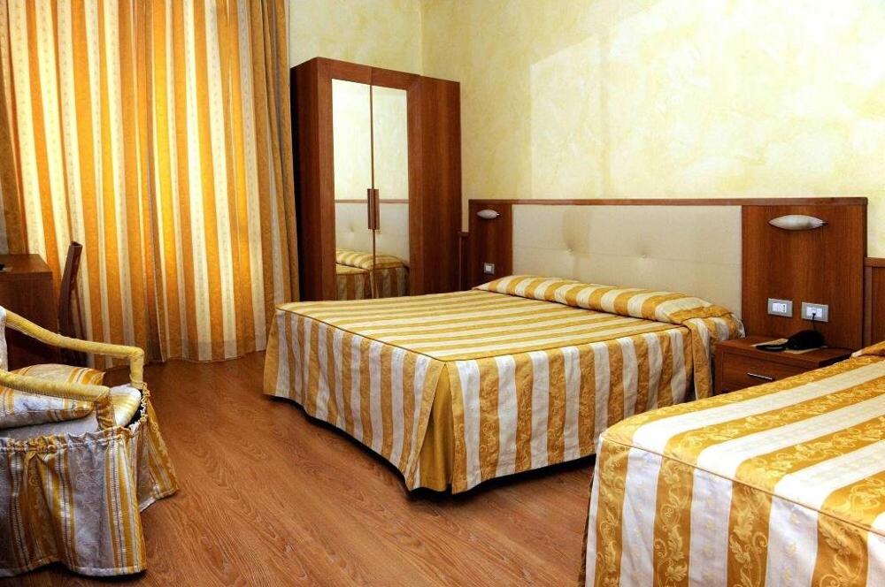 Foto de una habitación de Hotel Corallo