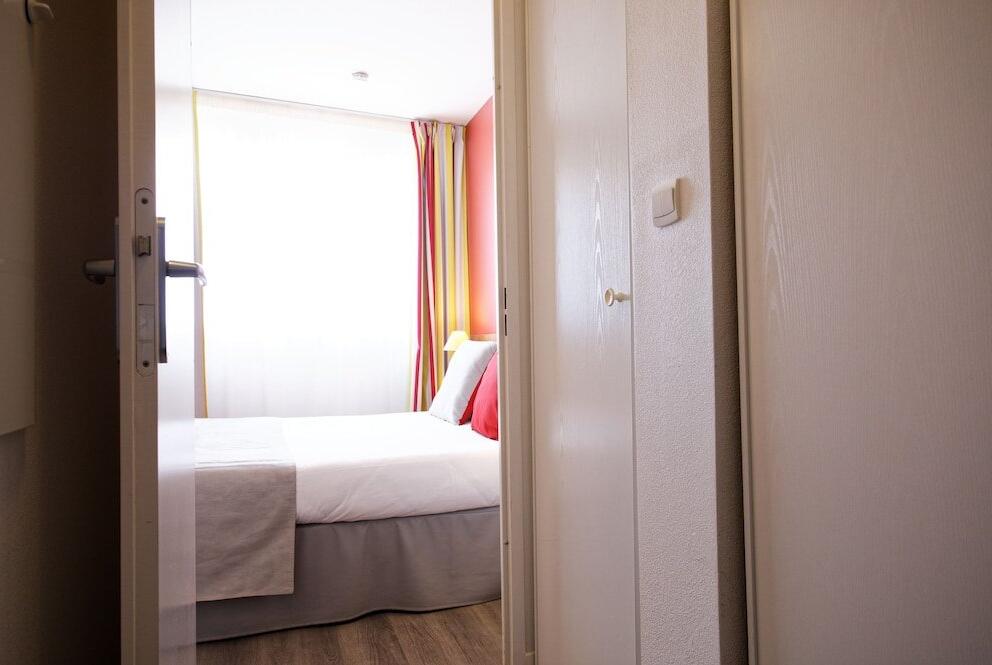 Foto de una habitación de Aparthotel Mer &amp;amp; Golf City Perpignan Centre