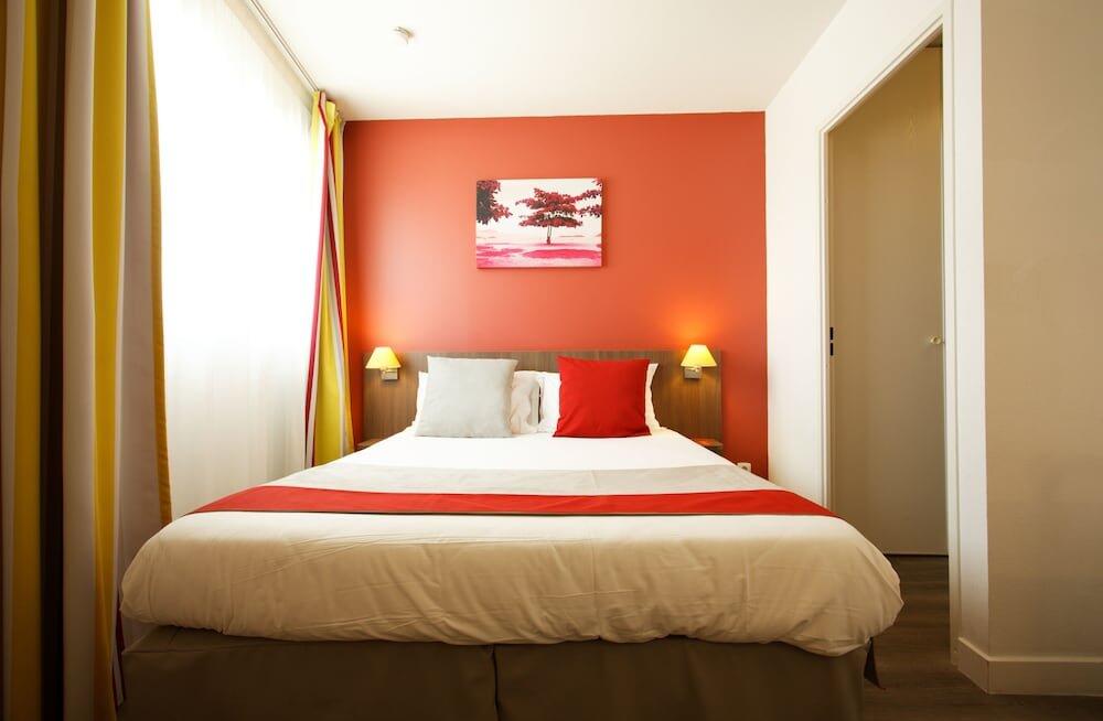 Foto de una habitación de Aparthotel Mer &amp;amp; Golf City Perpignan Centre