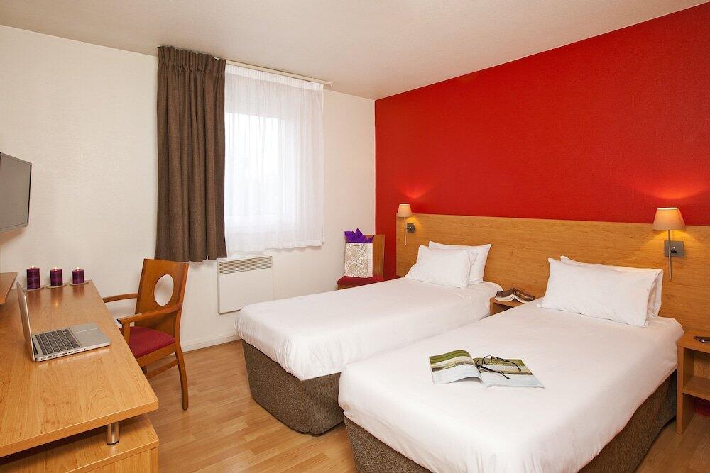 Foto de una habitación de Aparthotel Séjours &amp;amp; Affaires Bordeaux de L&amp;#039;Yser