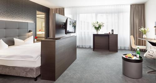 Foto de una habitación de Victor&amp;#039;s Residenz-Hotel Berlin Tegel