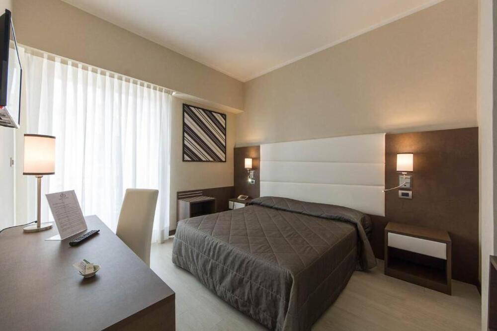Foto de una habitación de Reginna Palace Hotel