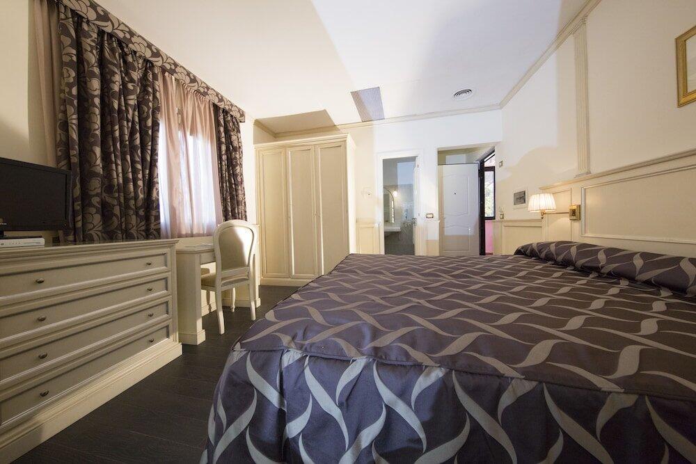 Foto de una habitación de Mancini Park Hotel
